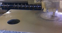 290911_cnc_machine_beginning_the_routing_process_of_the_middle_hole_to_be_used_by_children_and_wheelchair_users_and_to_re-fill_water_bottles