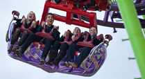 People_enjoying_a_rollercoaster_at_winter_wonderland_signpost