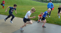 Children_do_a_sprint_finish_on_the_timing_track_at_the_hub_in_the_regent_s_park_signpost