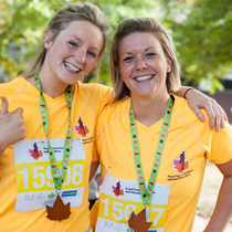 Ladies_celebrating_with_their_medals_after_completing_the_royal_parks_foundation_half_marathon_square