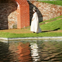 Lady_in_baroque_custome_walking_in_water_gardens__bushy_park_square