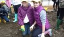 Eugenie_and_friend_planting_daffodils_in_the_park_listing